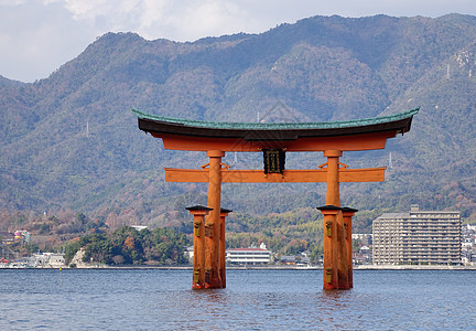 日本水岛神社的漂浮大门旅行地标历史性佛教徒海岸世界吸引力宫岛神社日落图片