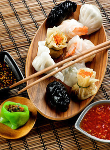 分排序点数总和草席饺子蟹肉美食筷子阴影橙子小吃面团点心图片