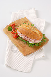 配火腿的新鲜三明治早餐午餐面包白色食物砧板餐垫小吃包子图片