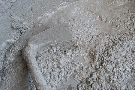沙 水泥和水的混凝土混合步骤石膏工匠砂浆石工托盘工具工作石匠工人图片