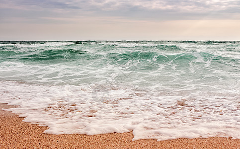 海浪在沙沙滩上流散闲暇假期休息风暴海洋危险攻击力量管子地平线图片