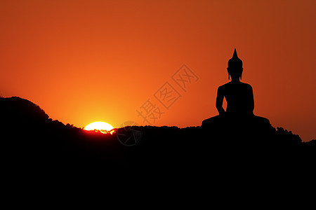 日落和佛天空地标宗教冥想佛教徒阳光文化雕塑雕像太阳图片