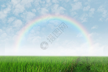 带彩虹的绿地季节晴天环境爬坡天空土地阳光草地地面太阳图片