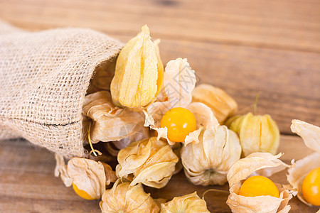 Cape 鹅莓Physalis 用旧木制 健康食品热带醋栗种子宏观浆果植物营养食物果味橙子图片