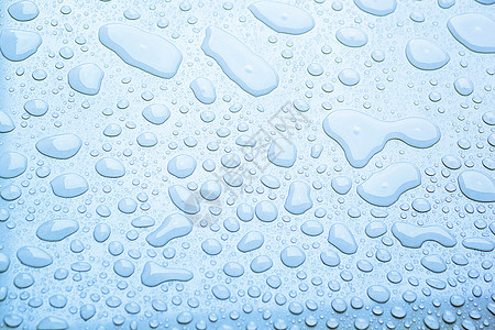 蓝色表面浮子表层水滴的底部背景图片