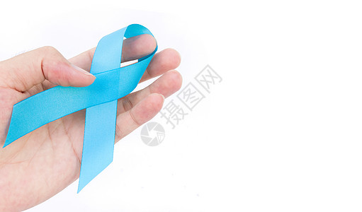 在白背景前列腺癌上 手握蓝丝带图片