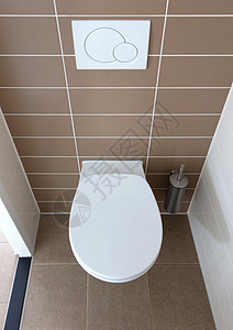 洗手间中的白色厕所碗制品棕色陶瓷卫生卫生间座位浴室优雅图片