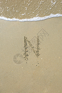 沙滩上写的信公司收藏学习字体字母海滩支撑棕色打字稿脚本图片