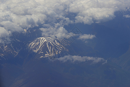 山顶有雪地形飞机旅行高度蓝色城市环境高山照片沙漠图片
