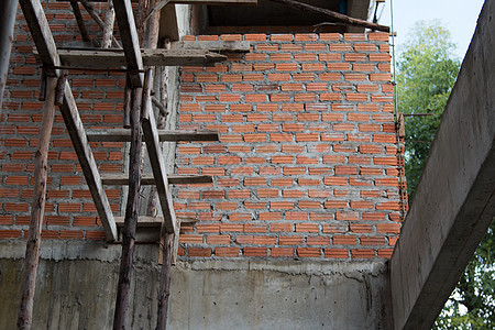 建筑建设中使用的建筑结构图起重机绿色蓝色商业项目框架金属建筑学材料水泥图片