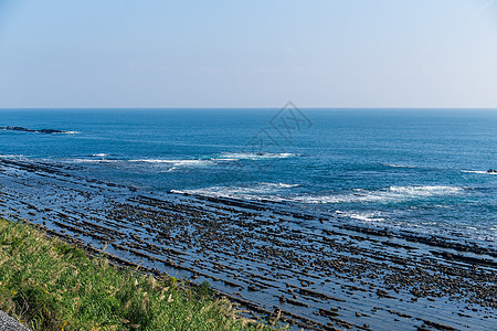 日本宫崎市的恶魔洗脸板石头波纹海洋海景海浪天空蓝色公园地质学海岸线图片
