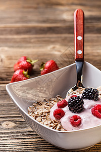 穆埃斯利杯早餐盘子饮食酸奶燕麦水果背景浆果薄片产品图片