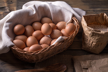 鸡蛋收集篮子农场棕色蛋壳收藏乡村柳条背景图片