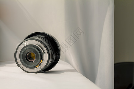 白色布布上黑色相机放大镜头功能镜片电影反射玻璃宏观单反乐器色调照片图片