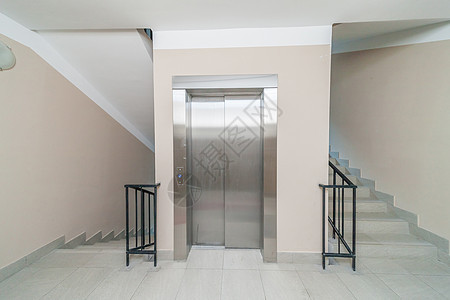 电梯和楼梯建筑学金属走廊酒店楼梯间天花板商业建筑办公室入口图片