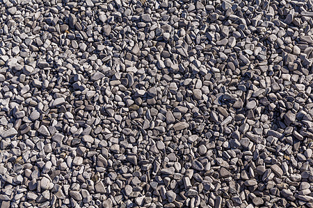 岩石背景圆形材料鹅卵石黑色灰色花园海滩石头圆圈假期图片