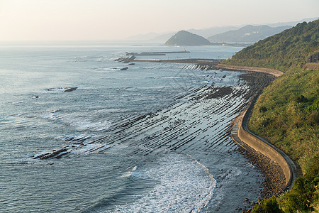 日本的魔鬼洗衣板旅行石头岩石宗教晴天海洋森林海岸蓝色天空图片