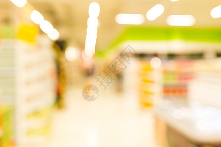 超级市场模糊背景与bokeh购物者产品食物顾客零售架子销售店铺大卖场商业图片
