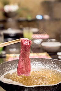 Matsusaka牛肉烹饪筷子橙子洋葱美食食物芝麻盘子用餐图片