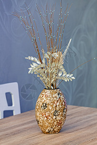 装饰花的花瓶奶油桌子棕色材料马赛克蓝色褐色风格商业配件图片