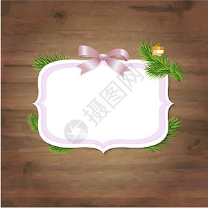 带粉红丝带和木制背景的圣诞标签图片