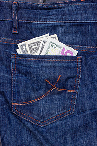 牛仔裤口袋里的美元成功首都现金蓝色牛仔布衣服储蓄金融账单笔记图片