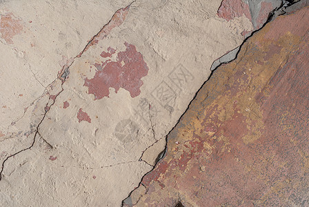 混凝土墙上的旧碎石膏 老混凝土墙的裂缝 背景纹理灰色合金象牙褐色棕褐色红色建筑水泥黄色石头图片