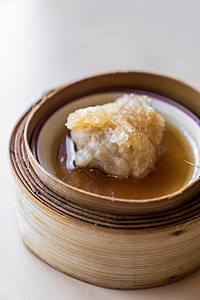 迪姆和芝麻小吃美食饺子黑色午餐篮子蒸汽猪肉白色图片