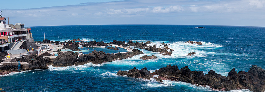 波多莫尼兹火山海岸蓝色岩石热带房子观光旅游海浪水池海景情调图片