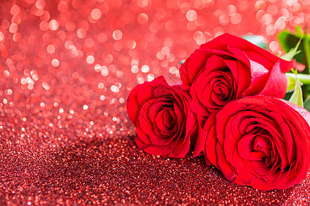 红玫瑰在闪光灯上庆典玫瑰礼物婚礼背景花束卡片图片