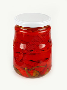 Jar 在白色的烂醉如泥的红辣椒养护玻璃蔬菜辣椒红色胡椒粉食物图片