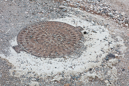 圆环钢洞盖街道城市基础设施金属工业检修圆圈石头圆形图片