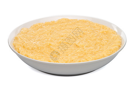 白陶瓷板上的体温沙漠面条盘子营养烹饪传统面粉小麦黄色白色挂面图片
