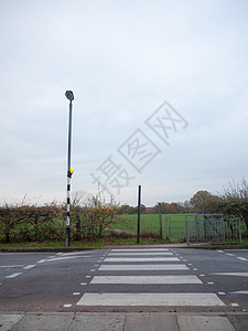 高杆街灯外的斑马横越道路安全代码斑马线车辆路面场景英语人行道街道交通图片