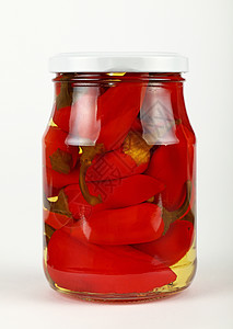 Jar 在白色的烂醉如泥的红辣椒红色食物玻璃养护辣椒蔬菜胡椒粉图片
