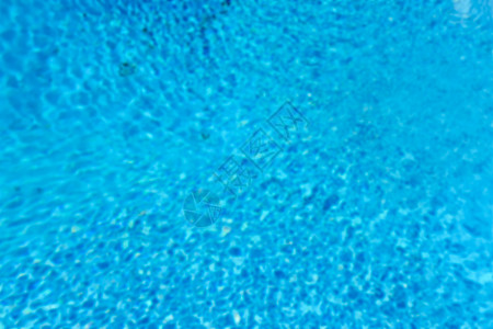游泳便便蓝色水面的散焦背景海浪阳光水池假期旅行液体波纹涟漪墙纸反射图片