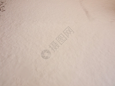 纯白色无标记干净的雪地背景地板表面纹理图片