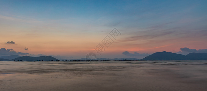 粉红大洋日落景点中越天空海滩季节地平线远景日落土地海岸线海岸天气图片