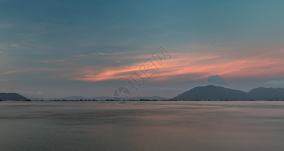 粉红大洋日落景点中越丘陵海景远景季节气候海岸天气天空日落地平线图片