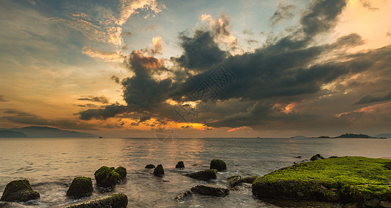 日出越南天空海岸岩石码头地平线丘陵气氛辉光热带季节蓝色图片