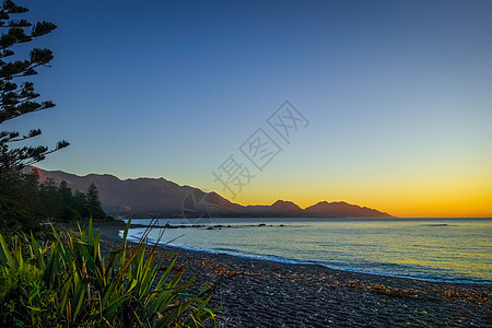新西兰Kaikoura海滩日落风景海浪海景地标悬崖旅游假期石头蓝色半岛图片