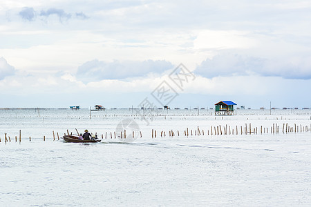 海上的风景捕鱼小屋农场旅行反射钓鱼橙子太阳渔夫海岸天空海洋图片