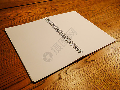 桌上的折叠书商业木头桌面文档工作床单教育艺术记事本笔记本图片