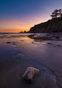 落基太平洋西北海滩日落悬崖地平线石质蓝色石头海滩风景旅行海浪海岸图片