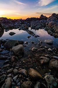 落基太平洋西北海滩日落地平线蓝色悬崖海滩岩石天空旅行海浪石质海洋图片