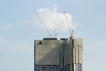 带有起重机和蓝天空的建筑工地建筑物商业城市建筑学财产工业水泥房子工作项目图片