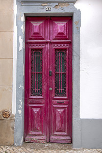 葡萄牙典型的木制门建筑大理石历史粉色建筑学街道框架古董城市房子图片