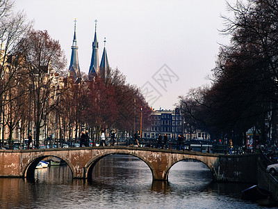 春初阿姆斯特丹运河历史旅游旅行建筑学遗产街道反射景观自行车首都图片