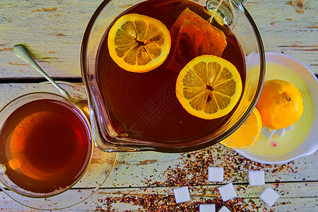 红茶 一杯红茶 手动榨柠檬 一壶红茶和几块糖 顶视图 平面设计勺子许可植物草本植物早餐香气石灰石餐厅飞碟杯子图片