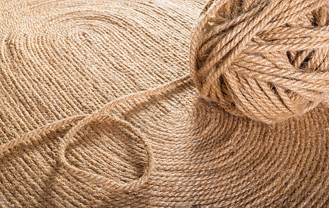 手工地毯纹理细绳编织棕色黄麻材料纤维白色羊毛绑扎圆形图片